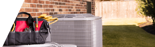 Tools sitting on top of AC condenser unit