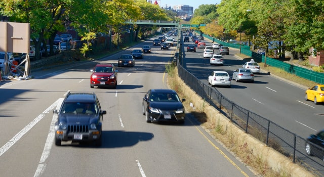 Cars driving up highway