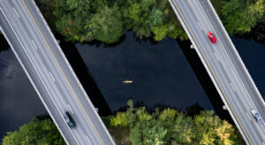 Cars driving on bridges over a river