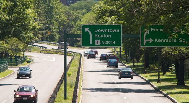 Cars on a Massachusetts highway that are insured.